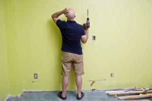 Man-doing-Home-Improvements-with-a-power-drill-000017272876_Medium