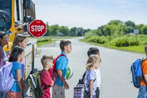 kids crossing school bus