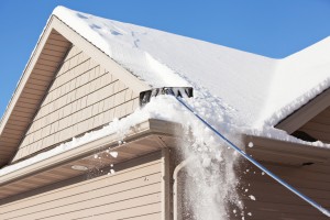 Roof Rake Removing Winter Snow