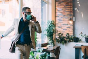 Businessman with mask is going to work during COVID-19 pandemic