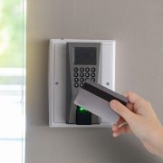 An image of an employee using an access control system, which can help reduce internal theft