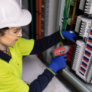 systems technician at work in the field