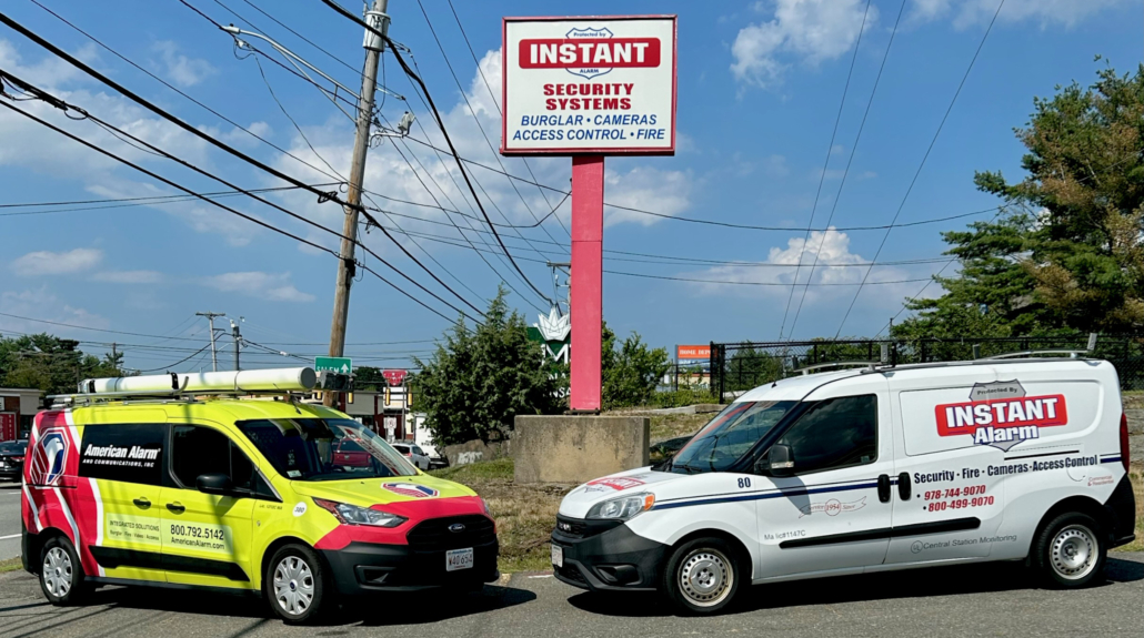 American Alarm and Instant Alarm vans come together